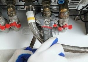engineer repairing a boiler in Huddersfield